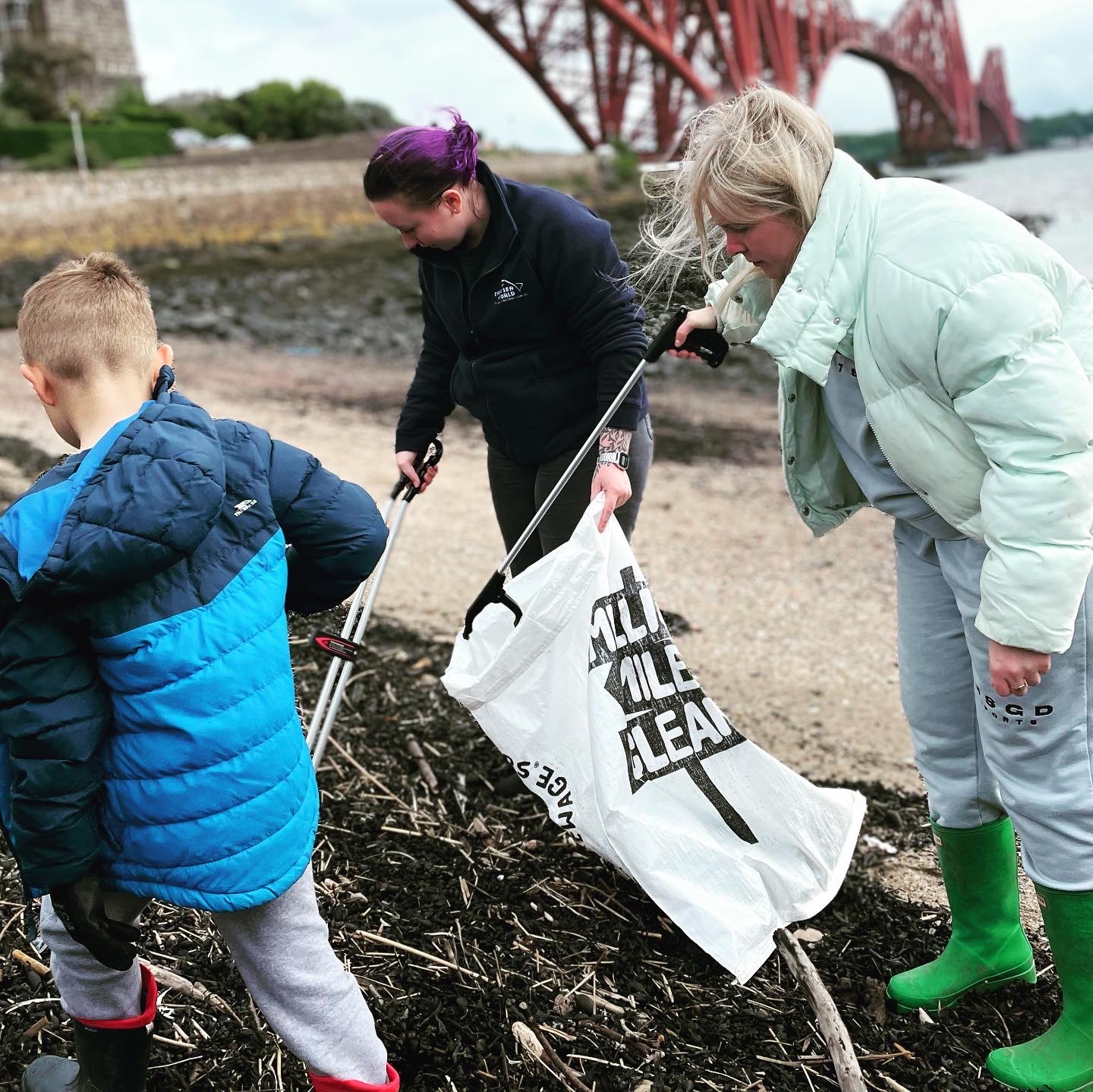 Our Staff member and volunteers beach cleaning